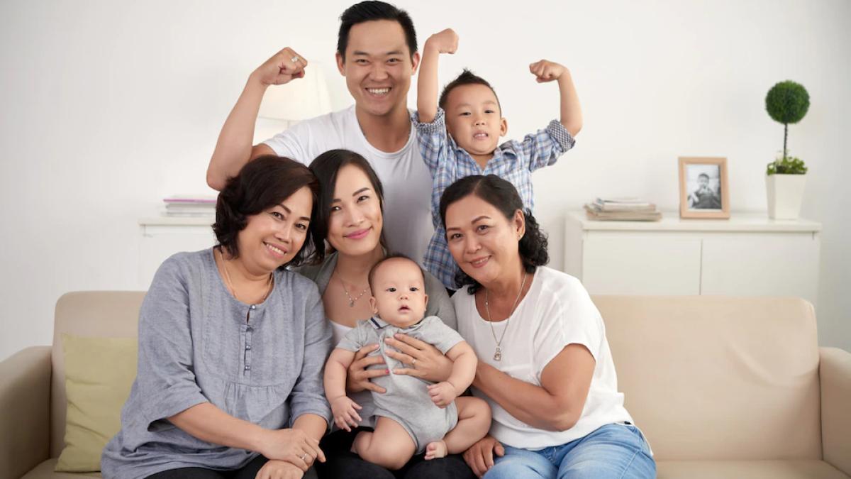 asian-extended-family-with-baby-toddler-posing-together-around-couch-home_1098-17644_59173300