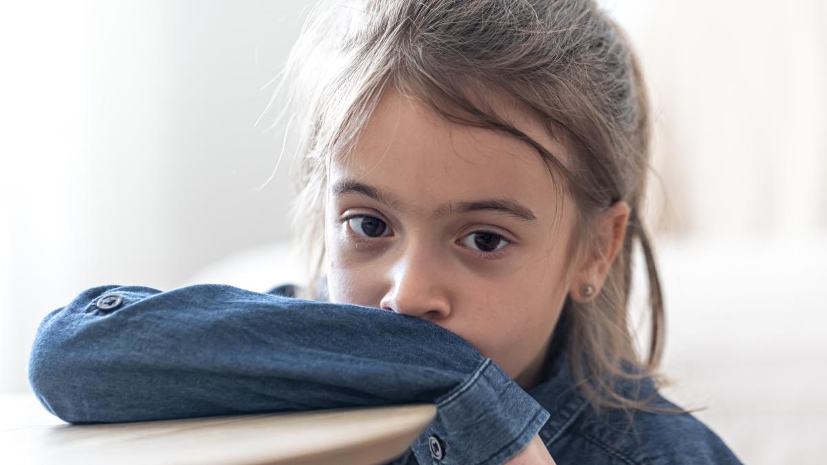 sad-girl-sitting-table-school-back-school-concept_48479300