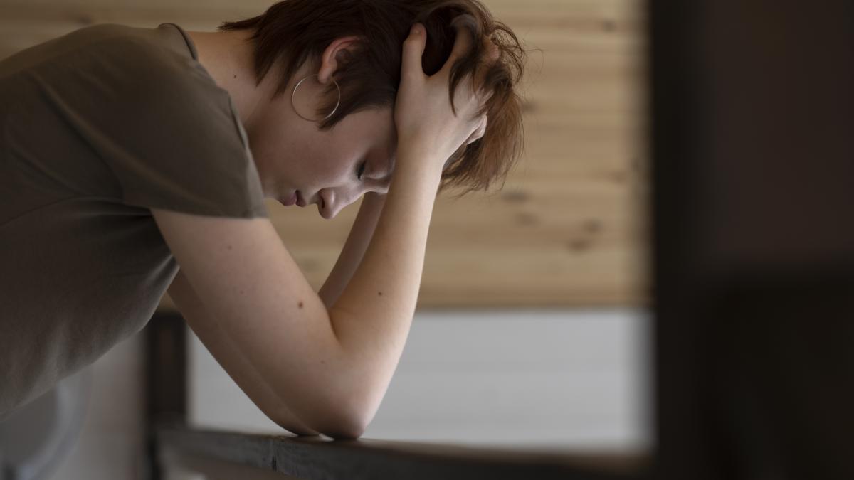 medium-shot-lonely-woman-home_83469900