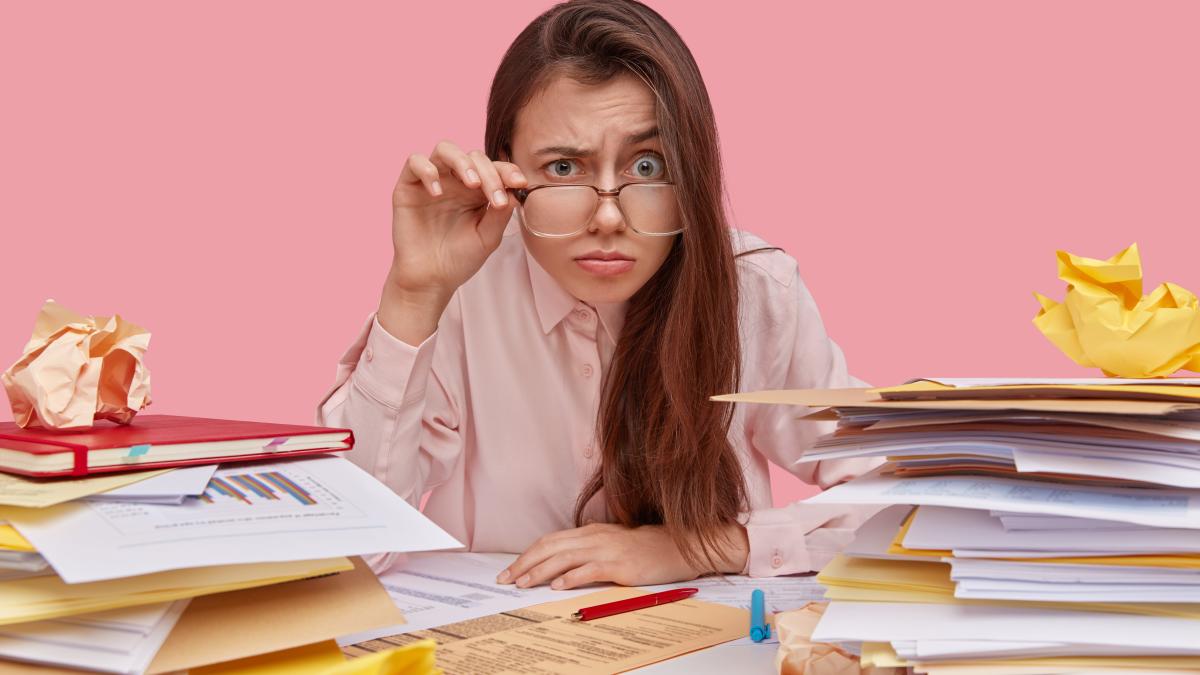 photo-funny-female-wonk-looks-through-thick-lenses-spectacles-has-surprised-indignant-expression-much-paper-work_82239100
