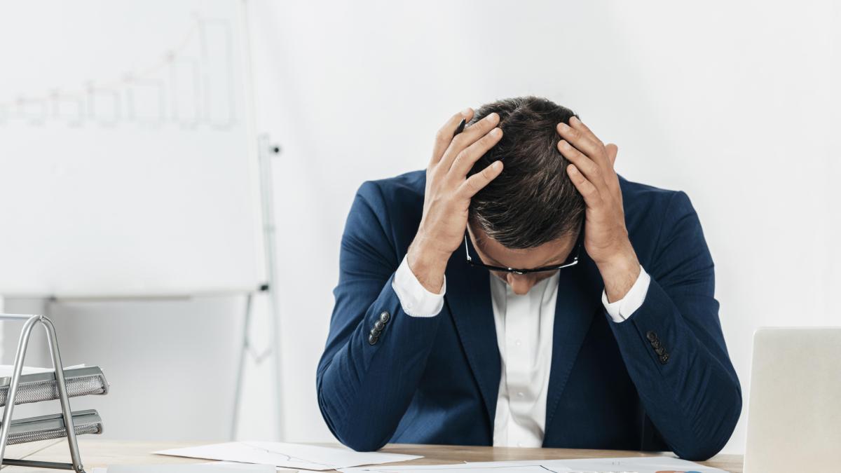 medium-shot-stressed-man-looking-papers_64988900