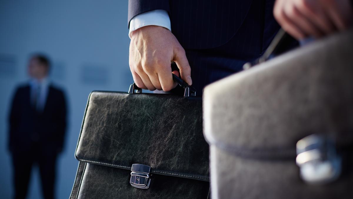 close-up-workers-with-briefcases_98878200