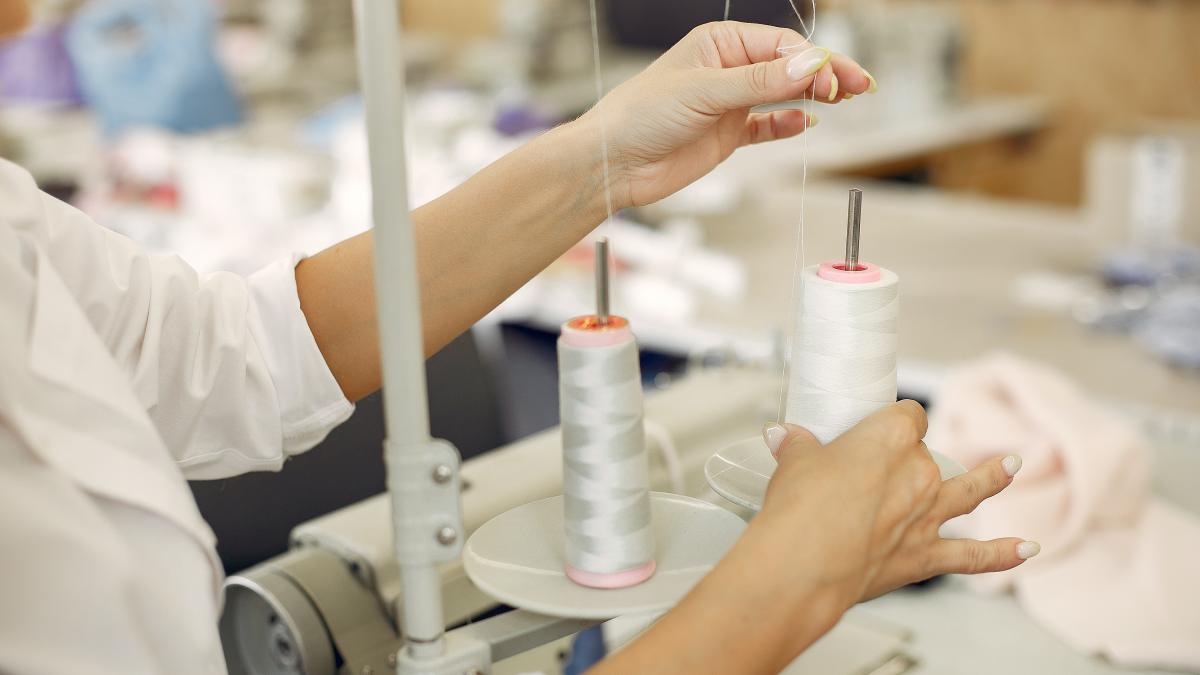 woman-standing-factory-with-thread_68910100