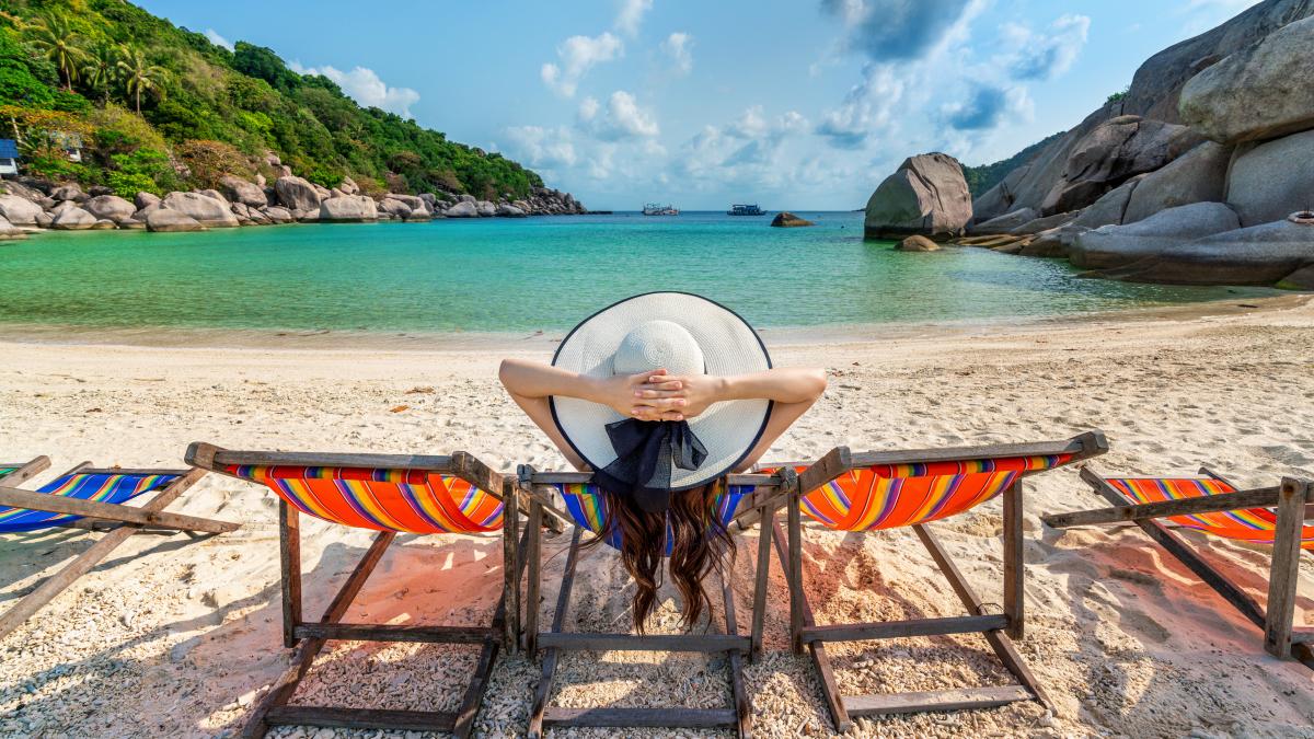 woman-with-hat-sitting-chairs-beach-beautiful-tropical-beach-woman-relaxing-tropical-beach-koh-nangyuan-island_45968800