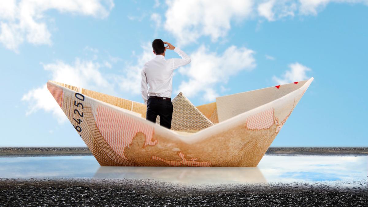 rear-view-businessman-paper-boat_25495700