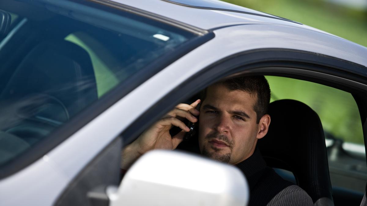 man-inside-car-using-cell-phone-2348830_90852700