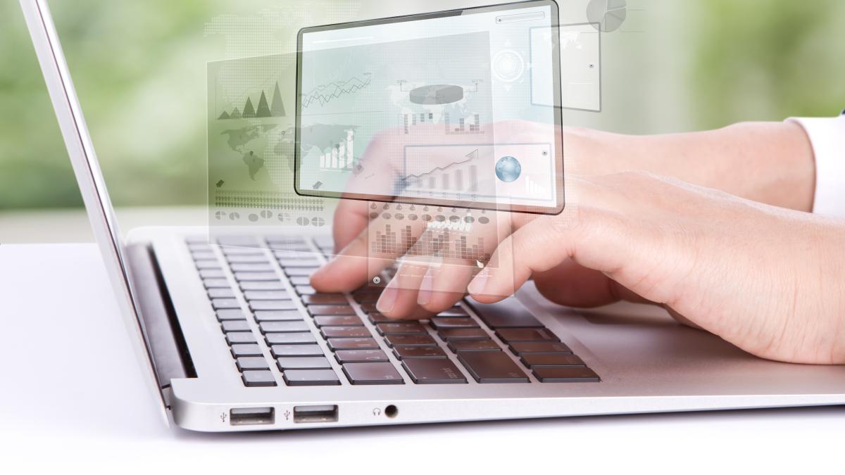 worker-looking-laptop-graphics_69487800