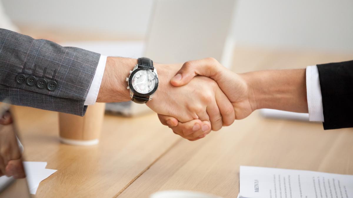 closeup-view-handshake-two-businessmen-suits-shaking-hands_03249700
