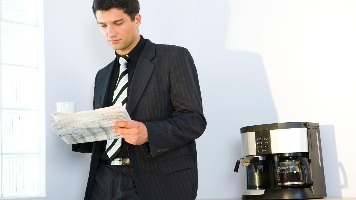 businessman-in-office-with-cup-of-coffee-2375145_08149800