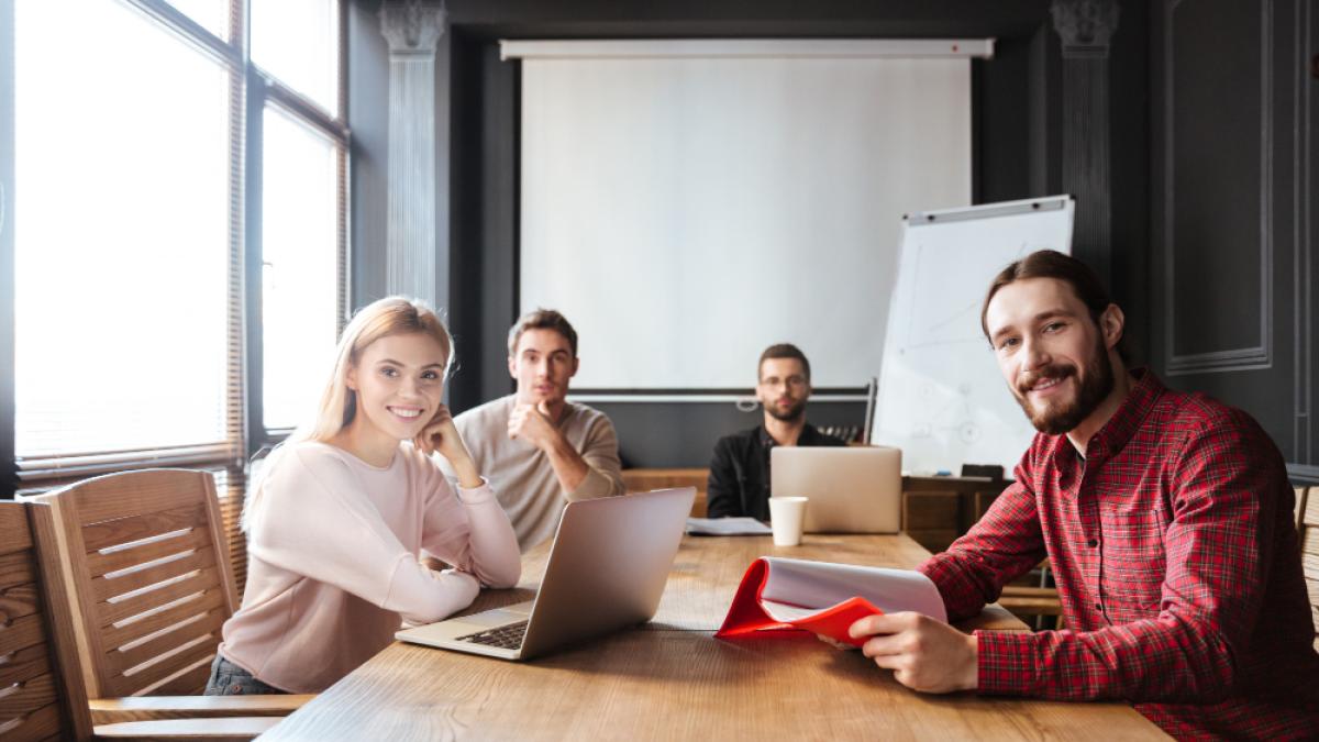 cheerful-colleagues-sitting-office_90487400