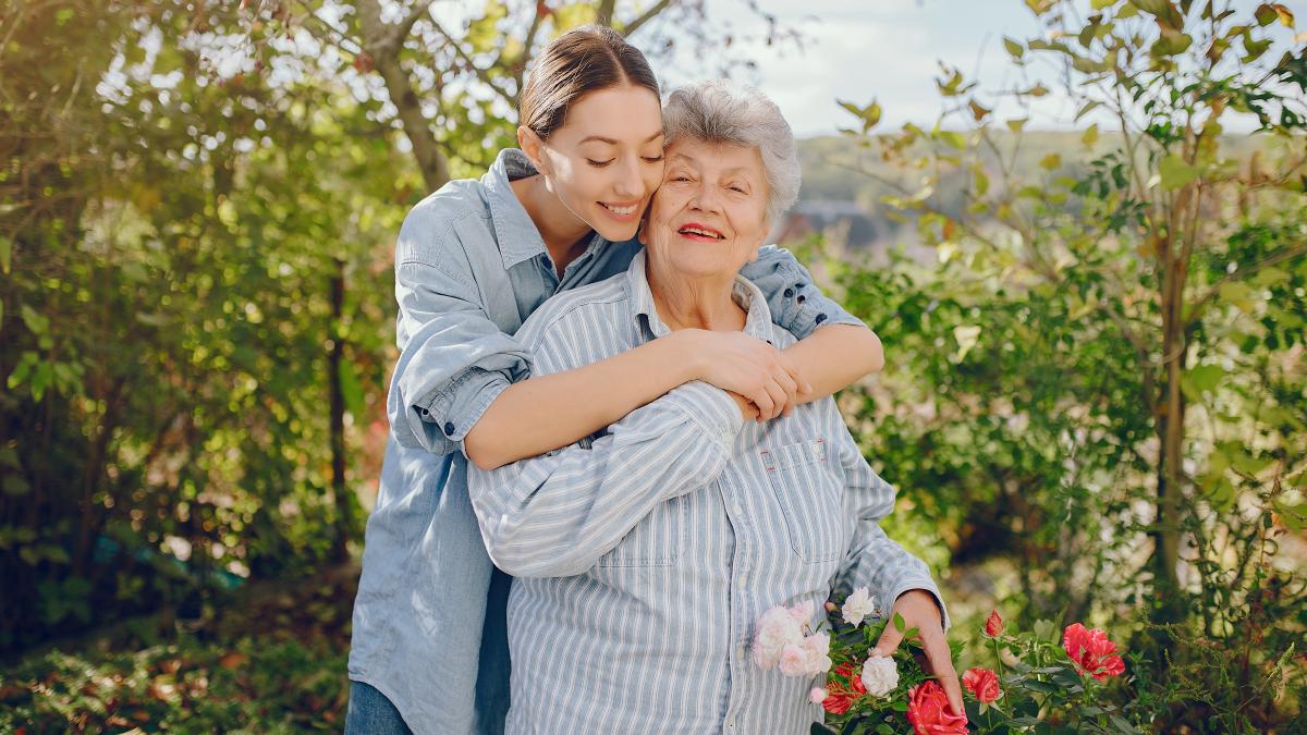 old-woman-garden-with-young-granddaughter_87209500