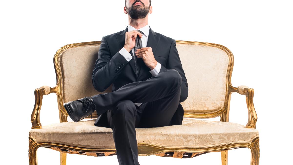 businessman-sitting-armchair_95567500