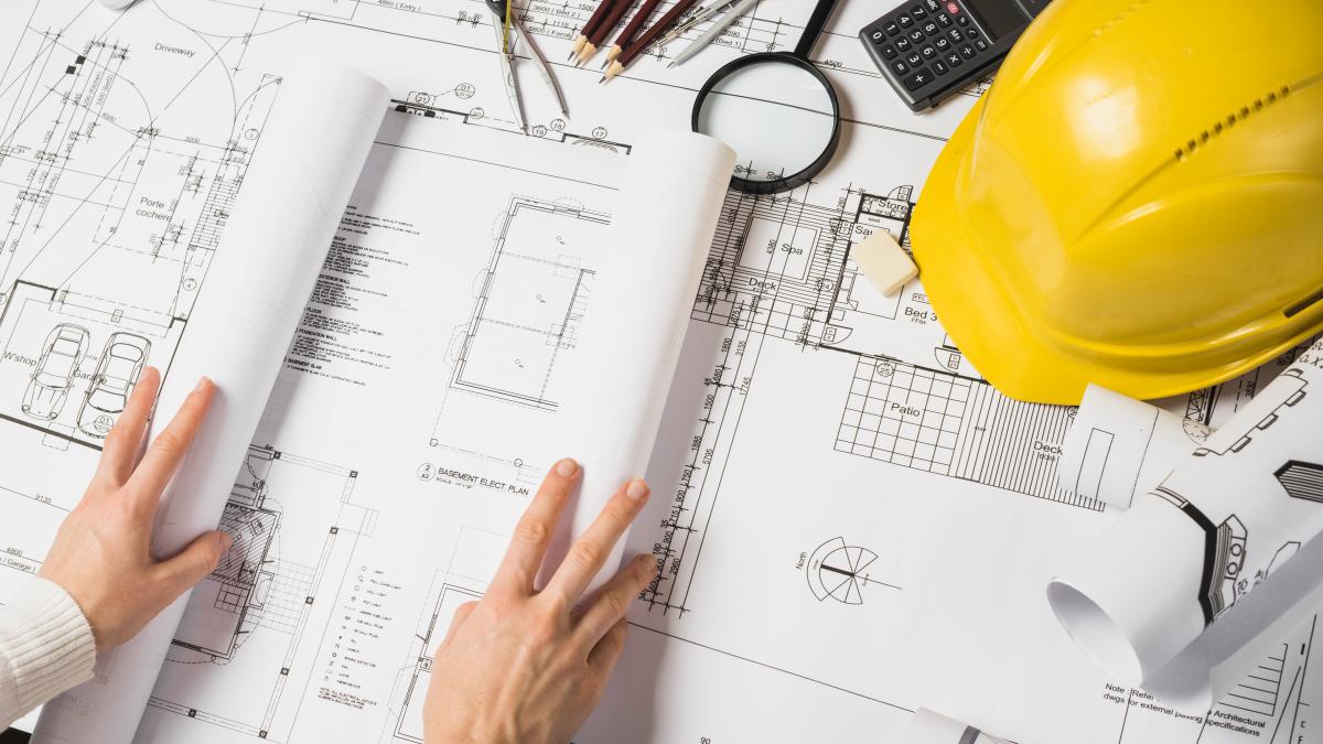 crop-architect-opening-blueprint_84211700