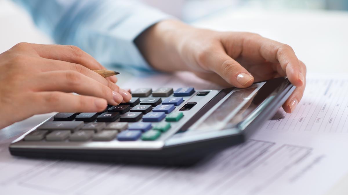 closeup-economist-working-counting-data-calculator-1_66993700