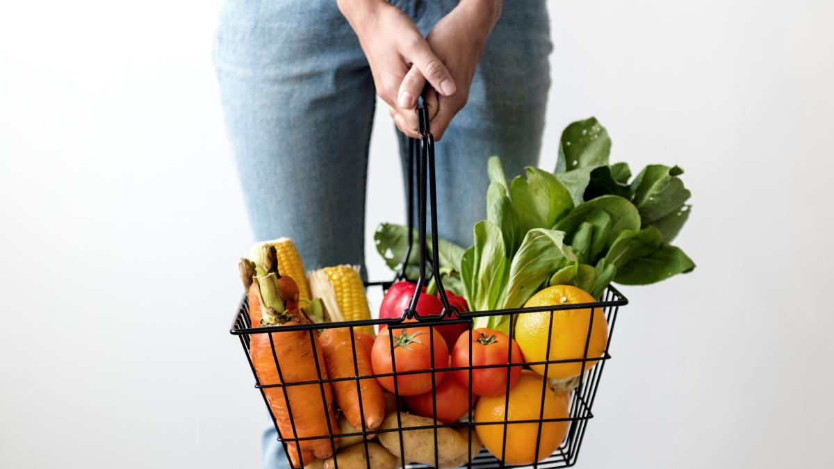 woman-holding-basket-vegetables_63928400