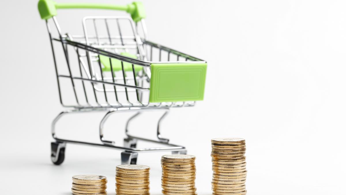coins-pile-shopping-cart-white-background_86401500