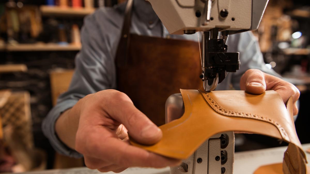 man-cobbler-stitching-leather-parts_80538600
