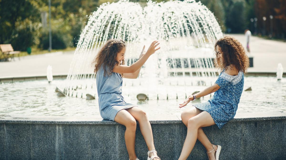 two-cute-sisters-summer-park_67464200