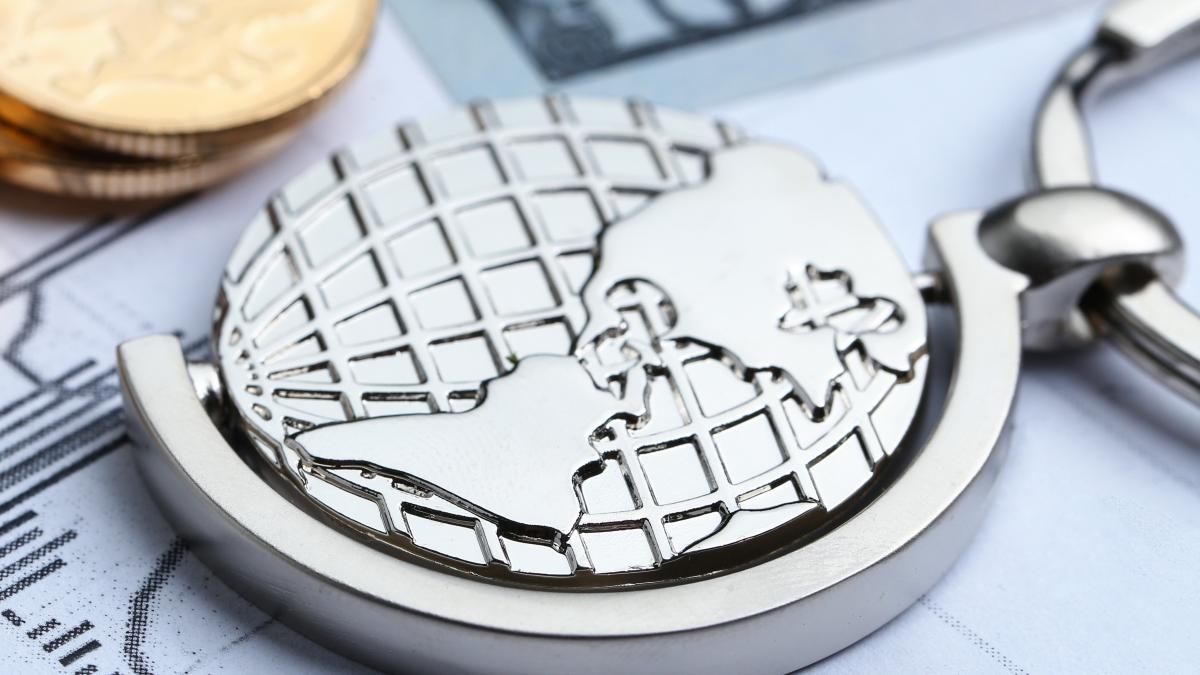 coins-paper-money-globe-white-statistic-form-background-1_86988400