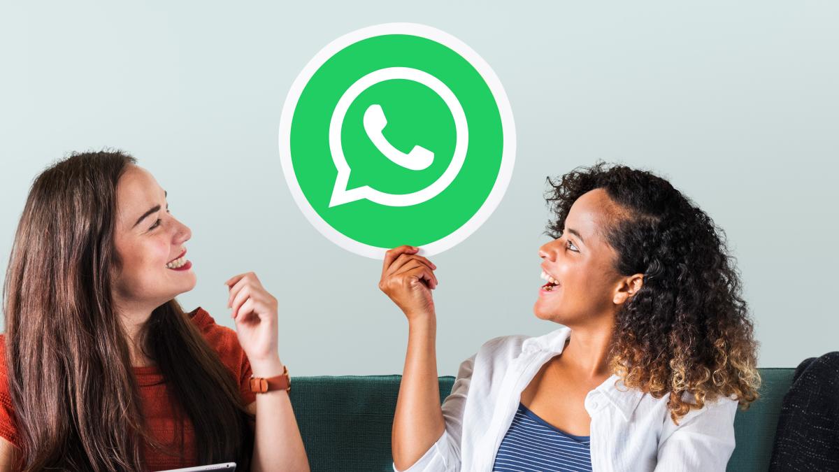 young-women-showing-whatsapp-messenger-icon_91672500