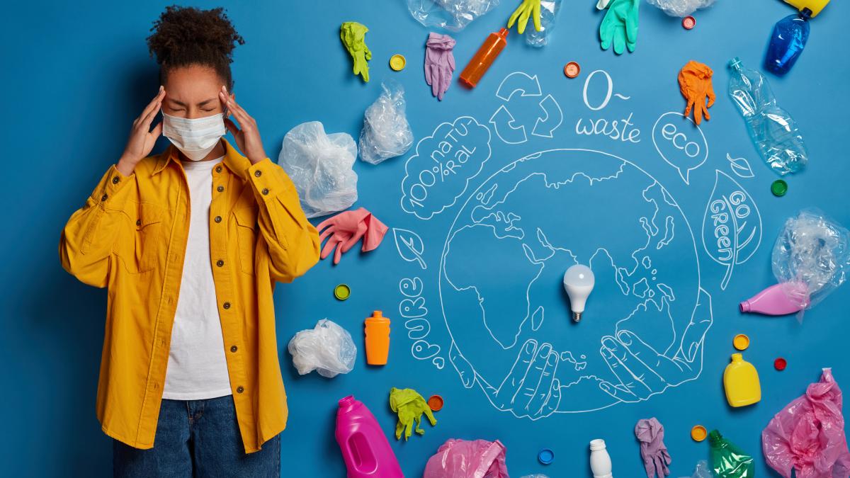 afro-woman-wears-protective-mask-avoids-radiation-has-headache-because-bad-ecological-conditions_49663700