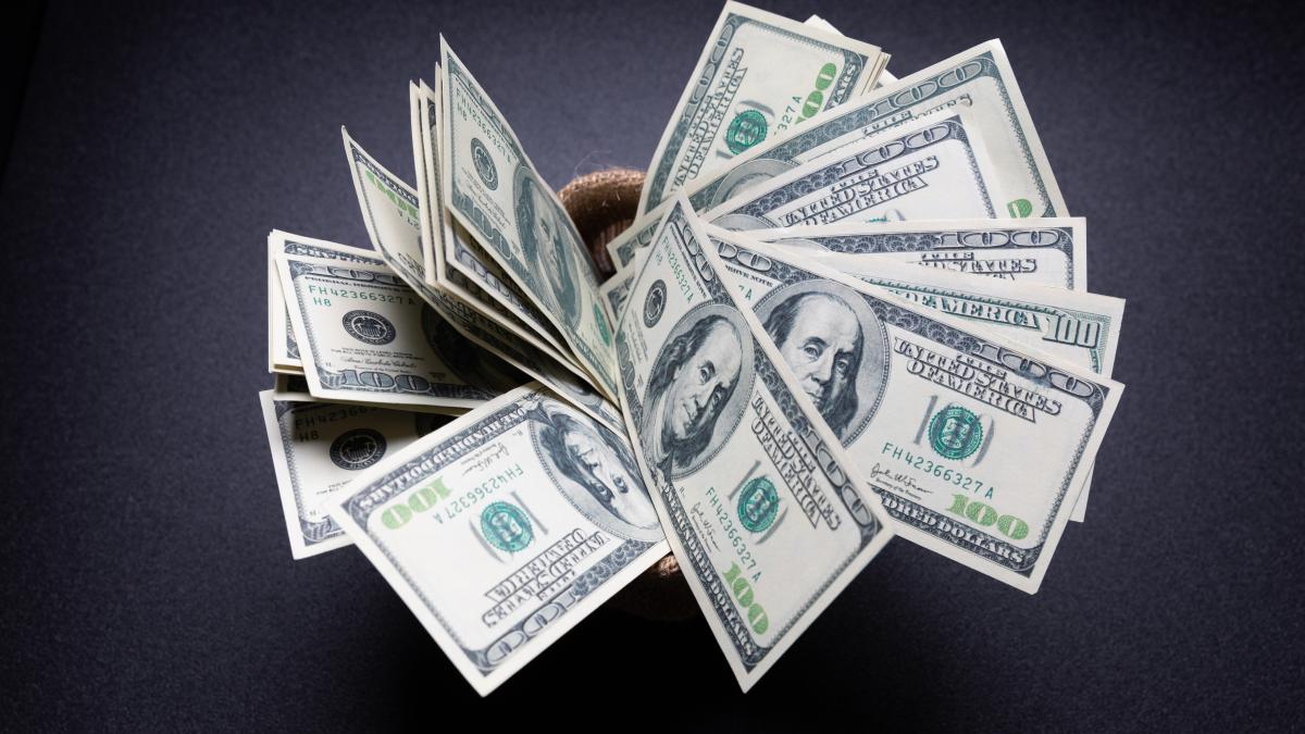 american-dollars-cash-money-sack-black-table-dark-room_62223700