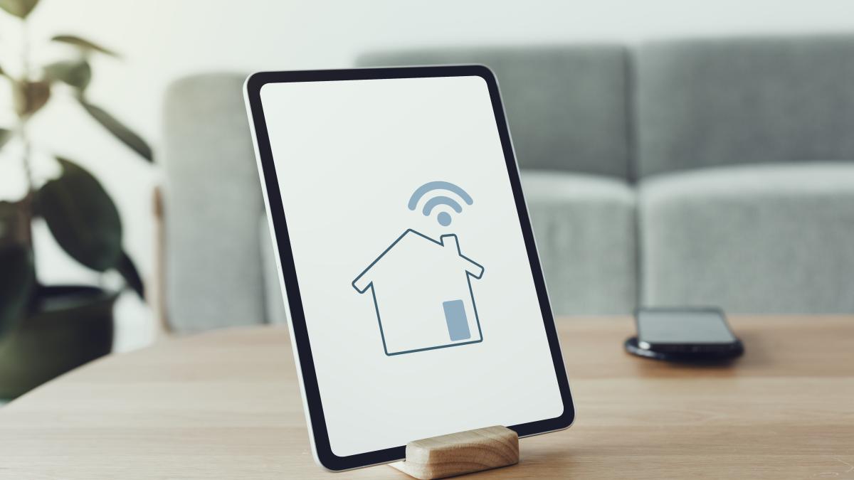 digital-tablet-screen-with-smart-home-controller-wooden-table_64601900