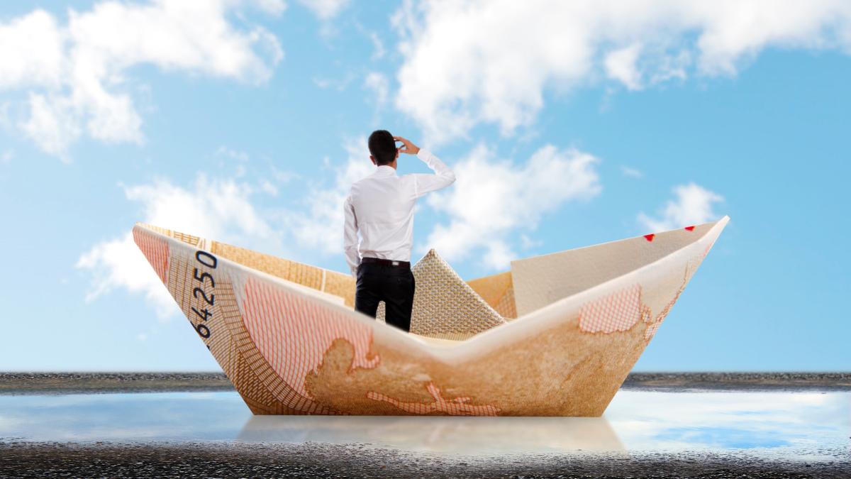 rear-view-businessman-paper-boat-1_70109800