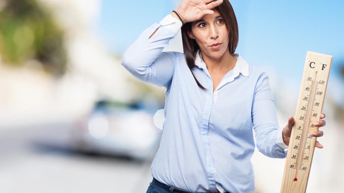 woman-with-heat-holding-large-thermometer_67735300