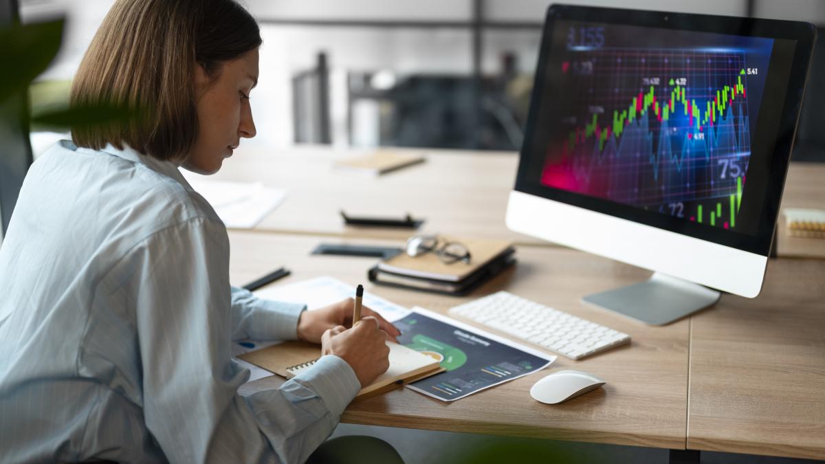 person-office-analyzing-checking-finance-graphs_93860400