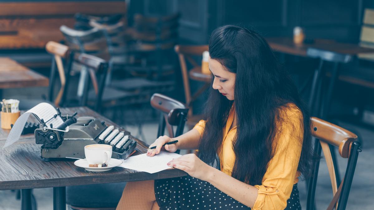 woman-sitting-writing-something-paper-looking-thoughtful-yellow-top-long-skirt-cafe-terrace-during-daytime_30137500