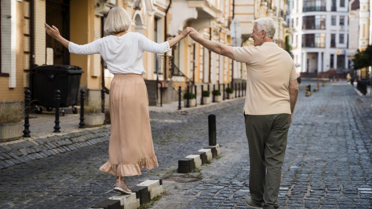 back-view-senior-couple-enjoying-walk-outdoors_36711400