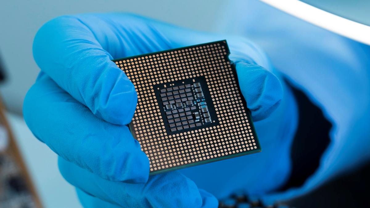 close-up-hand-with-glove-holding-chip_76571900