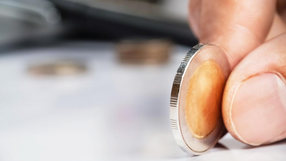 human-hand-holding-coin-copy-space-business-investment-plan-concept_74549100