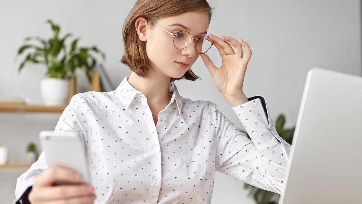 elegant-businesswoman-dressed-formally-sitting-with-laptop_65183800