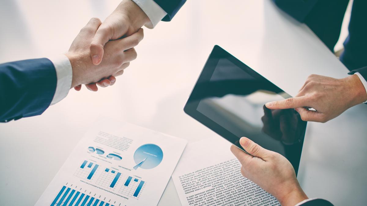 businessman-with-tablet-after-closing-deal_23595200