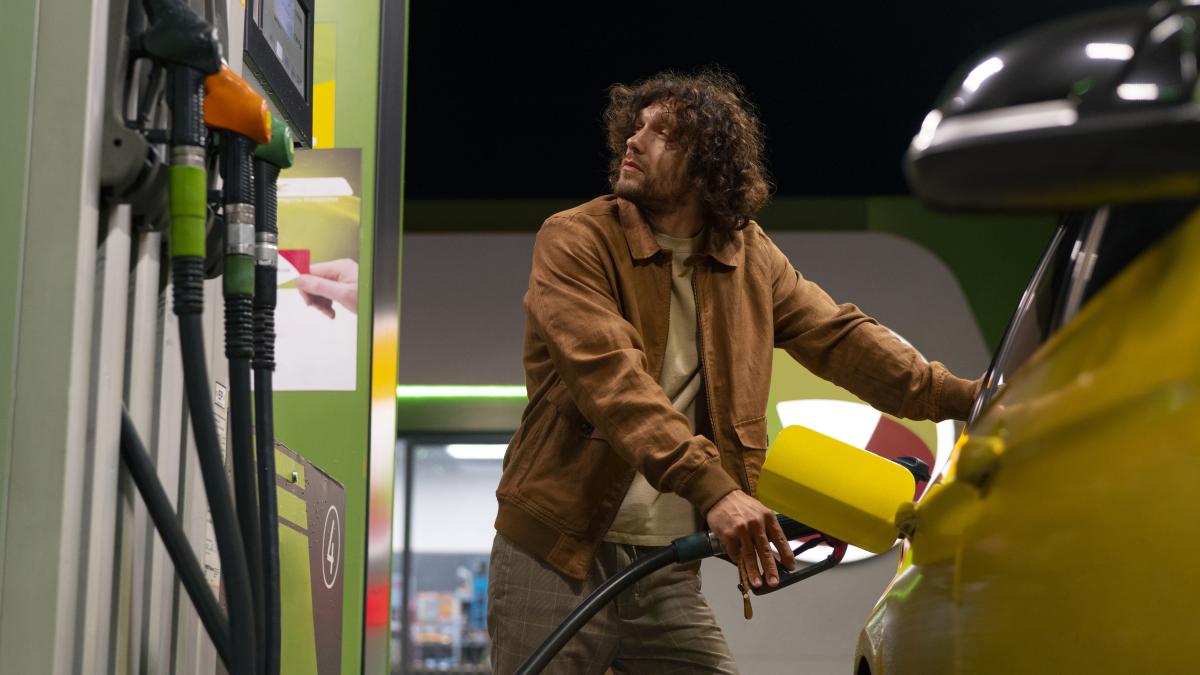 low-angle-man-gas-station_13786700