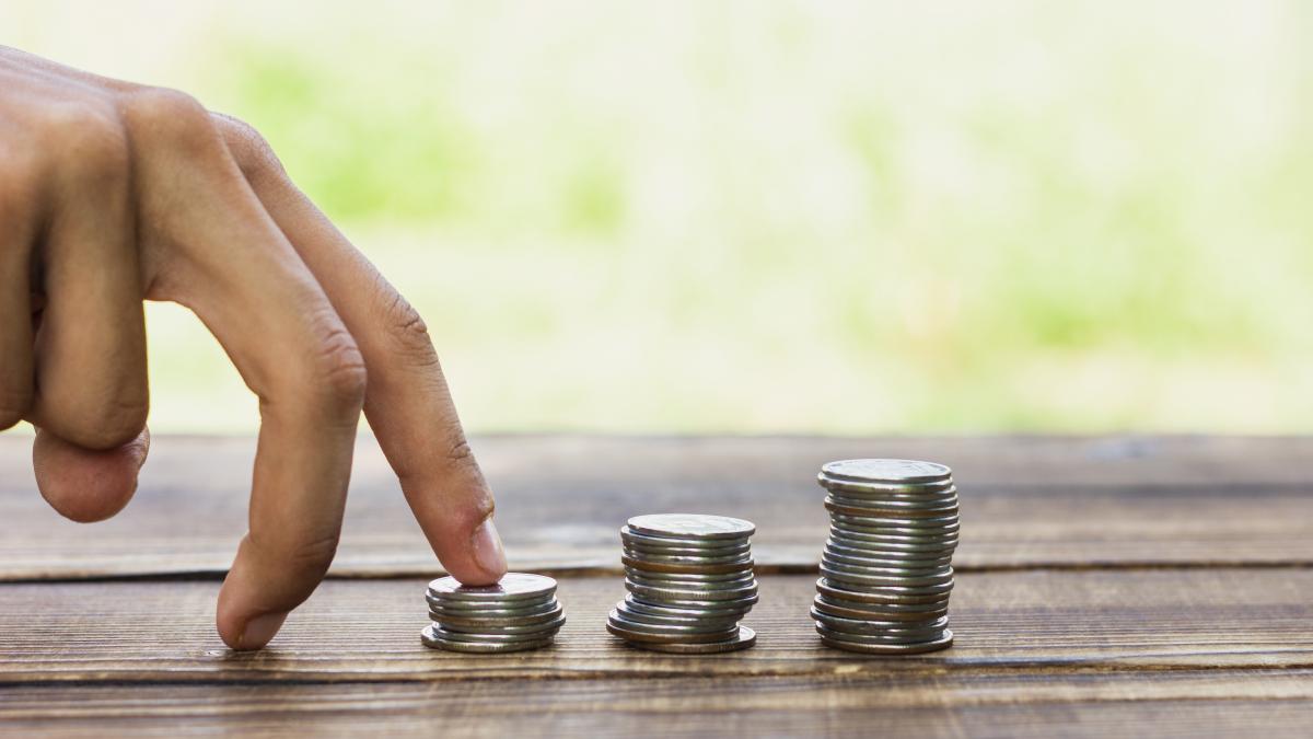 playful-hand-with-savings-coin_63160700