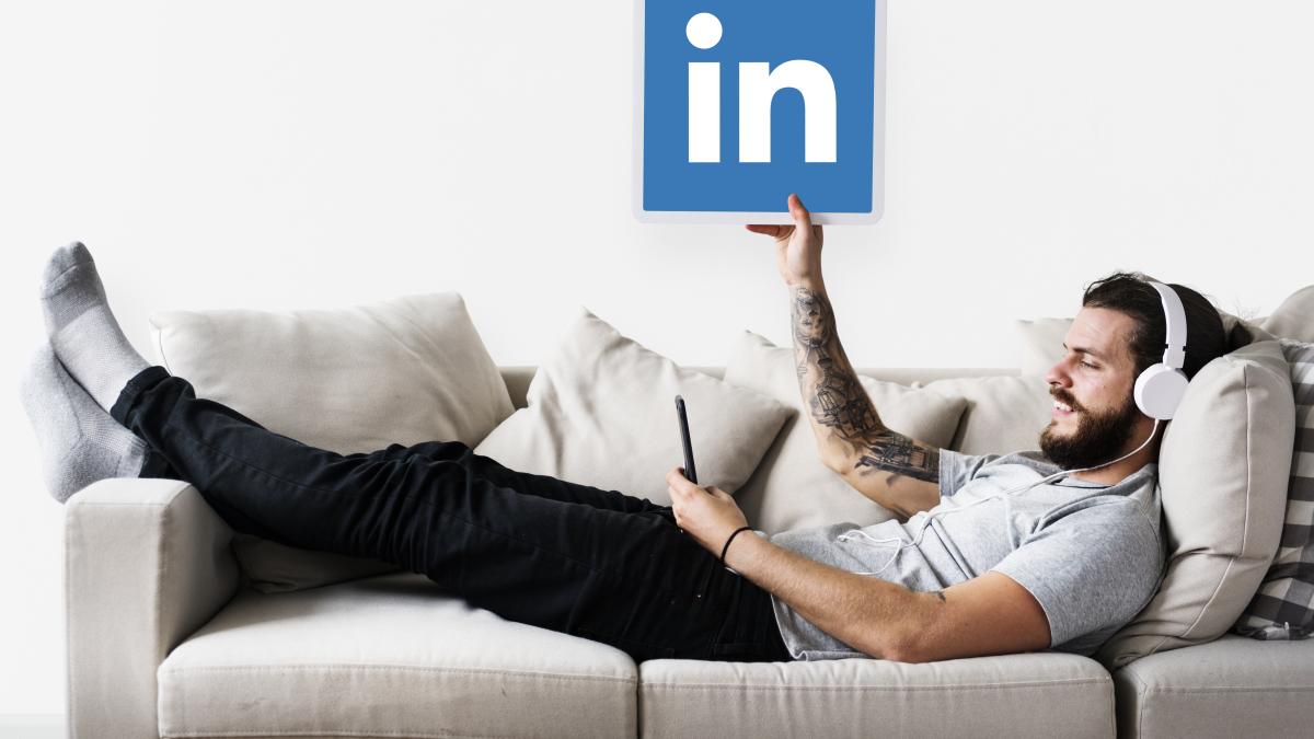 person-holding-linkedin-icon_34726300