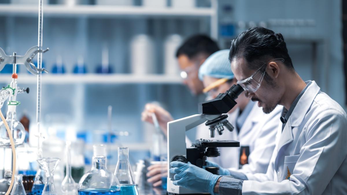 young-scientist-looking-through-microscope-laboratory-young-scientist-doing-some-research-1_31816800