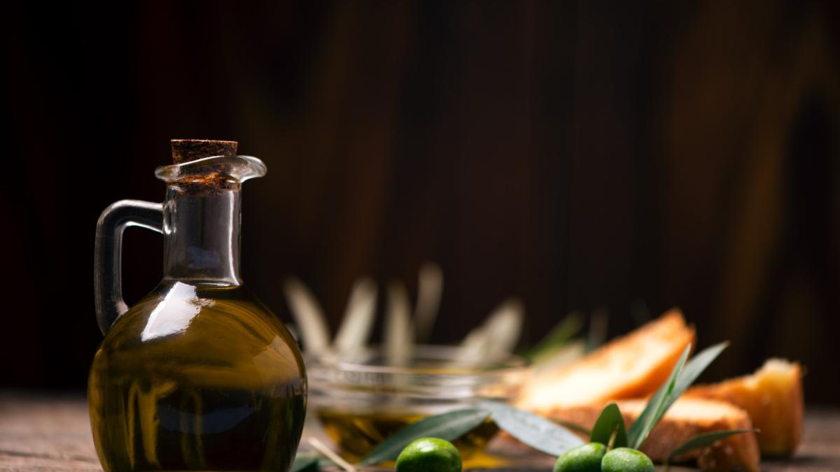 olive-oil-with-bread-wooden-table-rustic-vintage-composition-1_57112000