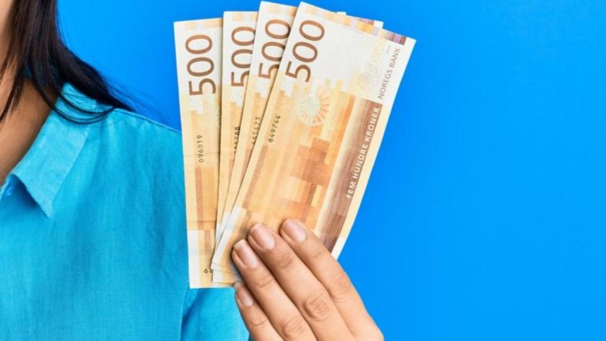 young-latin-woman-holding-norway-flag-krone-banknotes-smiling-laughing-hard-out-loud-because-funny-crazy-joke_22859300