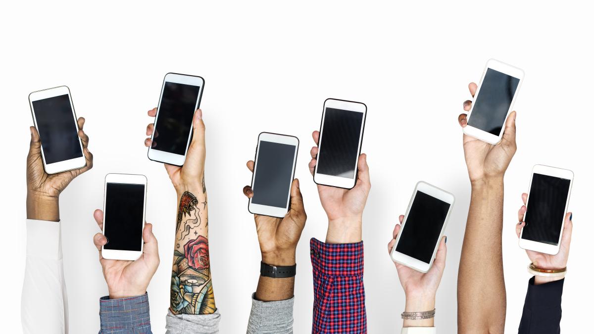 hand-holding-mobile-phones-isolated_72846500