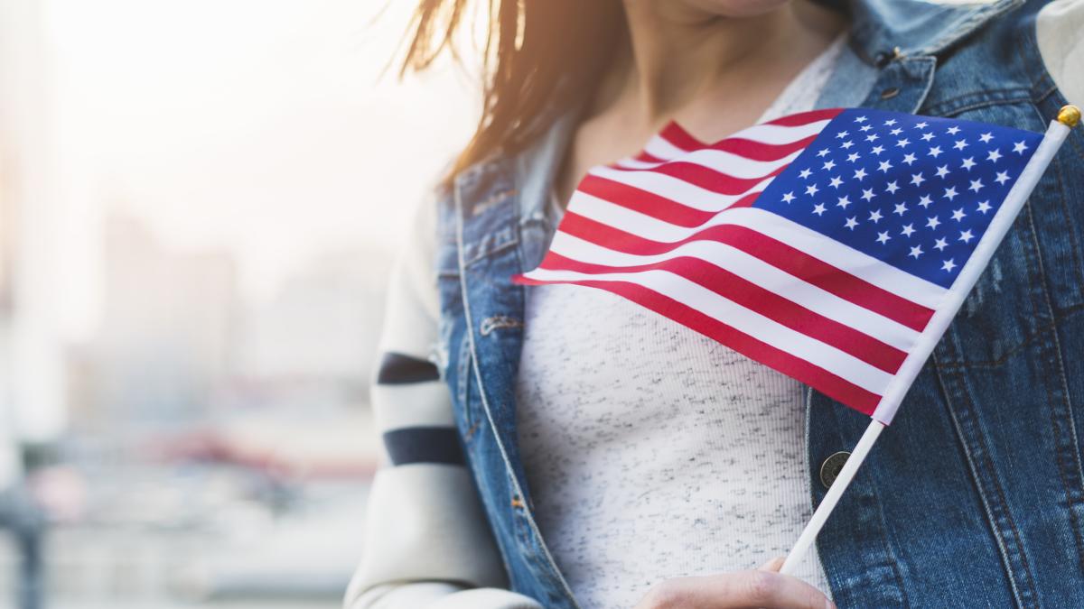 woman-with-american-flag-stick-hand_84342100