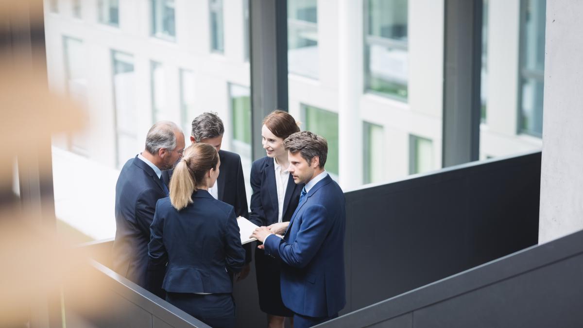 businesspeople-having-discussion-office_57111600