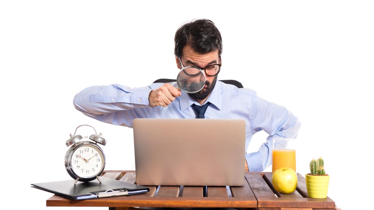 businessman-his-office-with-magnifying-glass-1_36329300