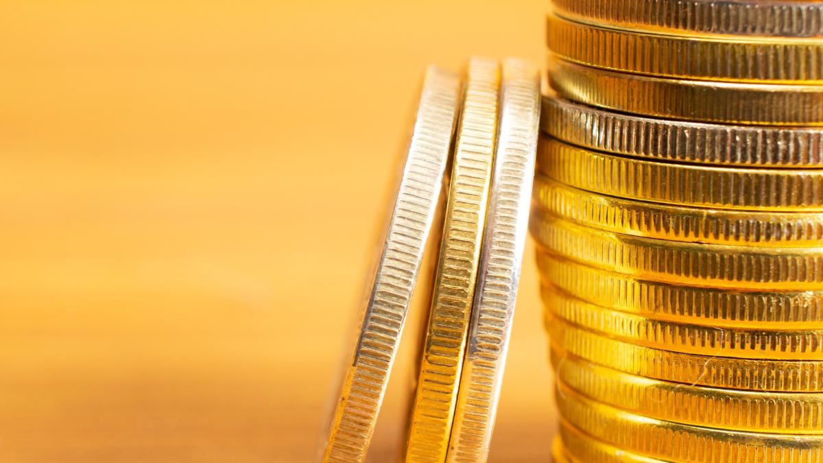 rows-stacks-coins-with-blurred-background-blank-space_52184600