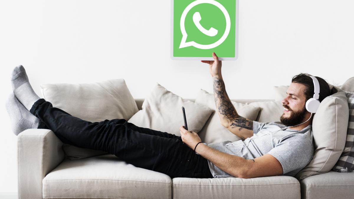 man-showing-whatsapp-messenger-icon_41292200