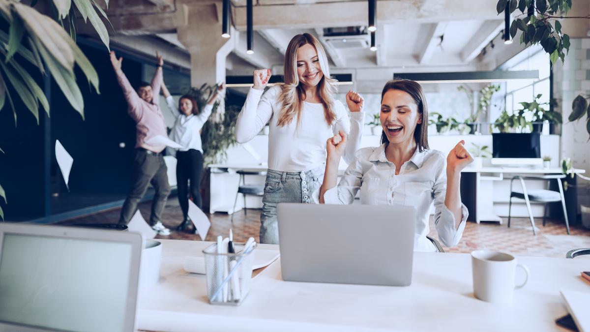 two-young-happy-businesswomen-celebrating-project-success-office_56013500