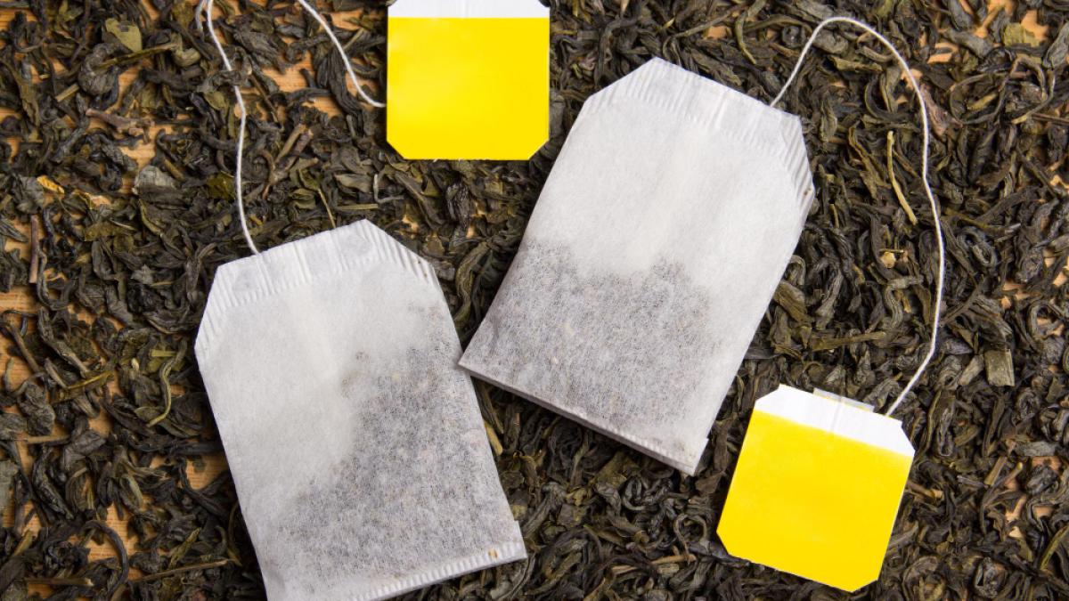 background-with-dried-black-tea-tea-bags_87172500